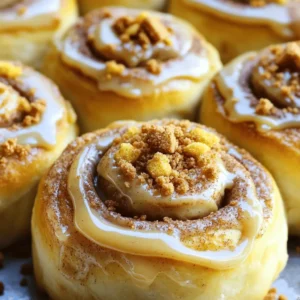 - 4 cups all-purpose flour - 1/4 cup granulated sugar - 1 packet (2 1/4 teaspoons) active dry yeast - 1 teaspoon salt - 1 cup whole milk, warmed - 1/4 cup unsalted butter, melted - 2 large eggs, at room temperature - 1/2 cup Biscoff cookie butter - 1 tablespoon ground cinnamon - 1/2 cup brown sugar, packed - 1/4 cup powdered sugar (for icing) - 1 tablespoon milk (for icing) - Optional: crushed Biscoff cookies for topping When making Biscoff cookie butter cinnamon rolls, the right ingredients make all the difference. First, we need all-purpose flour. It gives the rolls their structure. Granulated sugar adds that sweet touch to the dough. The yeast helps the rolls rise, making them light and fluffy. Salt is key too; it enhances all the flavors. Next, we warm the milk. This step helps activate the yeast. The unsalted butter adds richness, while the eggs give moisture and help bind everything together. The star of our show is the Biscoff cookie butter. Its unique flavor shines through every roll. Ground cinnamon and brown sugar create the sweet filling we all crave. Lastly, we have powdered sugar and milk for a sweet icing that ties everything together. By using these ingredients, you set yourself up for a delicious treat. For the full recipe, check the previous section. - Combine 2 cups of all-purpose flour, granulated sugar, active dry yeast, and salt in a large mixing bowl. - In another bowl, mix together warmed milk, melted butter, and room-temperature eggs. Whisk until smooth. - Pour the wet mixture into the dry ingredients. Stir gently until just combined. - Gradually add the remaining flour, about 1 cup at a time, until a soft, slightly sticky dough forms. - Transfer the dough to a floured surface. Knead for 5 to 7 minutes until smooth and elastic. - Shape your dough into a ball. Place it in a greased bowl. Cover it with a cloth and let it rise in a warm spot until it doubles in size, about 1 hour. - Once the dough has risen, punch it down gently to release air. Roll it out into a 12x18-inch rectangle on a floured surface. - Spread Biscoff cookie butter evenly over the rolled-out dough, leaving a small border. - In a small bowl, combine brown sugar and ground cinnamon. Sprinkle this mixture generously over the cookie butter. - Starting from one long edge, roll the dough tightly into a log. Slice it into 12 equal rolls using a sharp knife. - Arrange the rolls in a greased baking dish with space between them to expand. Cover and let rise for another 30 minutes. - Preheat your oven to 350°F (175°C) while the rolls rise. - Bake the cinnamon rolls for 25 to 30 minutes, until golden brown on top. - While baking, prepare the icing by whisking powdered sugar and milk in a small bowl until creamy. - After baking, let the rolls cool for about 5 minutes. Drizzle the icing over the warm rolls. Add crushed Biscoff cookies on top if you like. For the full recipe, check the complete details above. Enjoy these delightful Biscoff cookie butter cinnamon rolls! To get the right dough, aim for a soft and slightly sticky feel. If it's too wet, add a bit more flour. If it's too dry, a splash of milk can help. When kneading, the dough should spring back when touched. This springiness shows it’s ready to rise. To know if the dough has risen properly, look for it to double in size. It should feel light and airy. After about an hour, gently poke it. If the dough holds the indent, it’s ready to roll out. You can add spices like nutmeg or cardamom for a warm twist. If you want more filling, try adding chocolate chips or nuts. These give another layer of taste. For serving, warm rolls are best. Drizzle icing on top and sprinkle with crushed Biscoff cookies. This makes a lovely presentation. You can even serve them with whole Biscoff cookies on the side for added flair. To test for doneness, look for golden-brown tops. You can also tap the bottom of a roll. If it sounds hollow, it’s baked through. For golden-brown rolls, keep an eye on them in the oven. If they start to brown too quickly, cover them with foil. This helps ensure even baking without burning. {{image_4}} You can play with flavors to make these rolls even more fun. - Chocolate chip Biscoff cookie butter cinnamon rolls: Add chocolate chips to the filling. The chocolate pairs nicely with the cookie butter. - Adding fruit or nut fillings for extra taste: Try adding chopped apples, pecans, or walnuts. They will add texture and flavor. Not everyone has the same diet. You can change the recipe to fit your needs. - Gluten-free option using almond flour: Use almond flour instead of all-purpose flour. This makes a tasty, gluten-free roll. - Vegan alternatives for butter and milk: Swap butter for coconut oil and milk for almond milk. This keeps it vegan and still delicious. How you serve the rolls can make a big difference. - Creative ways to serve or plate the rolls: Stack the rolls on a tiered stand for a fancy look. You can also use a flat plate for a more casual vibe. - Using different toppings or icing flavors: Try using cream cheese icing or a caramel drizzle instead. You can also add crushed Biscoff cookies on top for extra crunch. These variations make your Biscoff cookie butter cinnamon rolls unique and exciting. Check out the Full Recipe for all the details! To keep your Biscoff cookie butter cinnamon rolls fresh, place them in an airtight container. This method helps prevent them from drying out. If you have more rolls than you can eat, consider freezing them. Wrap each roll tightly in plastic wrap, then place them in a freezer bag. This way, they can last up to three months in the freezer. When you're ready to enjoy a leftover roll, preheat your oven to 350°F (175°C). Place the rolls on a baking sheet. Cover them with aluminum foil to keep them soft. Heat for about 10 minutes or until warm. For a microwave option, heat a single roll for 15-20 seconds. However, the oven keeps the texture better. If you want to restore their soft and gooey goodness, consider adding a touch of extra Biscoff cookie butter on top before heating. Enjoy the warm, rich flavor! Yes, you can use store-bought dough. It saves time and effort. Look for dough labeled as "cinnamon roll dough" for best results. Just roll it out and follow the filling steps. You will still enjoy that Biscoff flavor. These cinnamon rolls stay fresh for about 2 to 3 days when stored properly. Keep them in an airtight container at room temperature. They can also last up to a week in the fridge. Just warm them up before serving. Yes, you can prep the rolls the night before. After rolling the dough, place the rolls in a greased dish and cover. Refrigerate overnight. In the morning, let them rise for 30 minutes before baking. This gives you warm rolls with less work. If you can't find Biscoff cookie butter, try using almond butter or peanut butter. You can also make a homemade cookie butter by blending cookies with butter. This adds a unique twist while keeping the same creamy texture. To keep the rolls moist, do not overbake them. Check for doneness at 25 minutes. You want them golden, but not brown. Adding a little extra butter to the filling can also help keep them soft and rich. In this blog post, we explored how to make Biscoff cookie butter cinnamon rolls from scratch. We covered essential ingredients, step-by-step instructions, and offered tips for perfect results. You can even experiment with variations to suit your taste. Remember, these rolls are best fresh but can be stored and reheated. Enjoy baking, and savor the delicious flavors. You’ll impress family and friends with these tasty treats. Dig in and share your sweet creations!