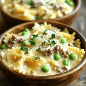 Here’s what you need for this creamy beef and bowtie pasta dish: - 8 oz bowtie pasta - 1 lb ground beef - 1 medium onion, finely chopped - 3 cloves garlic, minced - 1 cup heavy cream - 1 cup beef broth - 1 cup frozen peas - 1 cup grated Parmesan cheese - 2 tablespoons olive oil - 1 teaspoon Italian seasoning - Salt and black pepper to taste - Fresh parsley, chopped (for garnish) These ingredients create a rich and creamy sauce that coats every bowtie perfectly. Each item plays a key role in the final taste. The ground beef adds protein and heartiness. The heavy cream creates that velvety texture we love. The peas add a pop of color and sweetness. Feel free to adjust the seasoning to fit your taste. Fresh parsley gives a nice finish. This recipe makes a comforting meal that feels special. You can find the full recipe to guide you through the cooking process. - Bring a large pot of salted water to a boil. - Cook bowtie pasta until al dente and drain. To cook the pasta, you need a large pot. Fill it with water and add salt. This helps flavor the pasta. Once the water boils, add the bowtie pasta. Follow the package instructions for timing. You want the pasta firm but not hard. This is called al dente. When it's done, drain the pasta in a colander and set it aside. - Sauté onion and garlic in olive oil. - Brown the ground beef with seasoning. Next, let’s prepare the beef mixture. In a large skillet, pour in olive oil and heat it over medium heat. Add finely chopped onions first. Stir them for about 3-4 minutes. You want them soft and clear. After that, add minced garlic. Cook it for one more minute until it smells good. Now, increase the heat to medium-high. Add ground beef to the skillet. Use a spatula to break it up as it cooks. Brown the beef for about 5-7 minutes. Sprinkle in salt, black pepper, and Italian seasoning to boost the flavor. - Add beef broth and simmer. - Stir in heavy cream until thickened. Now, it's time to make the cream sauce. Lower the heat back to medium. Carefully pour in the beef broth. Let it simmer for a few minutes. This helps all the flavors mix well. After that, slowly stir in heavy cream. Keep cooking for about 2-3 minutes. You want the sauce to thicken and become creamy. - Toss cooked pasta and peas with cream sauce. - Heat through for even coating. Now, we’ll bring everything together. Add the cooked bowtie pasta and frozen peas to the skillet. Toss them gently in the cream sauce. Make sure the pasta and peas are fully coated. Allow the dish to warm through for another 2-3 minutes. This ensures everything is hot and mixed well. - Incorporate grated Parmesan cheese. - Adjust seasoning to taste. Finally, remove the skillet from heat. Sprinkle grated Parmesan cheese over the pasta mixture. Stir it well until the cheese melts into the sauce. Taste the dish, and add more salt or pepper if needed. This step makes sure your creamy beef and bowtie pasta is just right. For the full recipe, refer to the section above. To get that perfect al dente texture, cook your bowtie pasta just right. Start by boiling a large pot of water. Add a generous amount of salt; this helps flavor the pasta. Follow the package instructions for cooking time. Typically, that means cooking it for about 8 to 10 minutes. Test the pasta a minute or two before the time is up. It should be firm but not hard. Drain it carefully in a colander and set it aside. To boost the flavor of your creamy beef and bowtie pasta, consider adding more spices or herbs. A pinch of red pepper flakes can add a nice kick. Fresh herbs like basil or thyme can brighten the dish. For the best creamy consistency, make sure to stir the heavy cream in slowly. This helps it blend smoothly with the beef broth. Cook it until it thickens slightly, which should take about 2 to 3 minutes. When serving this dish, think about pairing it with a light salad. A simple green salad with a vinaigrette works well. You can also add garlic bread for a tasty side. For garnishing, sprinkle freshly chopped parsley on top. This adds color and fresh flavor. If you love cheese, feel free to add more grated Parmesan on each serving. This makes it look extra special! For the full recipe, check out the complete instructions above. {{image_4}} If you want to switch things up, try different meats. Ground turkey or chicken works well. For a vegetarian option, use lentils or mushrooms. These swaps make the dish lighter and still tasty. You can also change the pasta. Shells or penne can add a fun twist. As for sauces, try Alfredo or a garlic cream sauce instead for new flavors. Adding veggies boosts the nutrition in your creamy beef and bowtie pasta. Think about tossing in spinach, broccoli, or bell peppers. You can even sneak in some zucchini or carrots for extra color. Sauté these veggies with the onion and garlic. Use seasonal ingredients like asparagus in spring or butternut squash in fall. This keeps the dish fresh and vibrant. If you like heat, consider adding red pepper flakes or fresh jalapeños. Sprinkle some flakes in the cream sauce for a mild kick. For more heat, chop up jalapeños and mix them in with the beef. You can also use a spicy sauce like arrabbiata. Just remember to adjust the creaminess to balance the heat. Add a bit more cream for a rich texture that cools the spice. For the full recipe, check out the Creamy Beef Bowtie Delight. To store creamy beef and bowtie pasta, let it cool down first. Place the leftovers in an airtight container. Make sure to close it tightly. This helps keep the dish fresh for about 3 to 4 days in the fridge. To keep the dish tasting great, cover it well. If you can, use plastic wrap before sealing the container. This extra layer keeps moisture in and air out. When you’re ready to eat, simply reheat the portion you want. If you want to save some for later, freezing works well. Transfer the cooled pasta to a freezer-safe container. Leave some space at the top, as the dish will expand when it freezes. You can also use freezer bags for easy storage. Just lay them flat for compact stacking. To thaw, move the container to the fridge for several hours or overnight. For a quick method, place the bag under cold water. Once thawed, reheat the pasta gently on the stove. Add a splash of cream or broth to keep it creamy. This will help it regain its delightful texture. For the full recipe, check the complete instructions. Yes, you can prepare this dish in advance. Cook the pasta and sauce separately. Store them in airtight containers. Refrigerate for up to three days. When ready to eat, combine them and heat on the stove. To keep the pasta creamy, add a splash of milk or broth when reheating. Heat gently over low heat. Stir often to prevent sticking. This method helps maintain the sauce's smooth texture. Absolutely! You can swap Parmesan for mozzarella or cheddar. Each cheese brings a unique flavor. Experiment with your favorite cheeses to find the best match for your taste. Pair this dish with a fresh salad or garlic bread. Steamed vegetables also work well. These sides add color and balance to your meal. They enhance the overall dining experience. Yes, this recipe is great for meal prep. You can easily double the ingredients for more servings. Portion out meals in containers for quick lunches or dinners. Enjoy your creamy beef and bowtie pasta throughout the week! This blog post covered how to make creamy beef and bowtie pasta. We explored key ingredients like bowtie pasta, ground beef, and Parmesan cheese. You learned step-by-step instructions, tips for enhancing flavor, and variations to try. Remember to store your leftovers properly for the best taste. With this guide, you can cook a dish that's not only delicious but also easy to prepare. Enjoy making it your own and share it with family or friends!