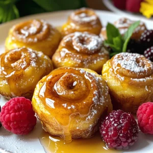 - 1 can of refrigerated cinnamon rolls - 4 large eggs - 1/2 cup milk - 2 teaspoons vanilla extract - 1 teaspoon ground cinnamon - 1/4 teaspoon ground nutmeg - 1/4 cup pure maple syrup - Powdered sugar - Fresh berries The main ingredients create a sweet and rich flavor. The cinnamon rolls bring warmth, while eggs and milk add creaminess. Vanilla, cinnamon, and nutmeg give depth. Maple syrup adds a sweet twist. Powdered sugar creates a lovely finish, and fresh berries bring a burst of color and freshness. - Dairy-free alternatives - Extra toppings like whipped cream or chocolate sauce For those who prefer dairy-free, use almond or oat milk. You can add whipped cream for a fluffy touch. Chocolate sauce can enhance sweetness and make it more decadent. The choice of toppings can elevate your bites, making them even more special. If you want to check out the full recipe, I highly recommend doing so for the best results! - Preheat your oven to 375°F (190°C). - Lightly grease a baking dish with cooking spray or butter. - Open the can of cinnamon rolls. - Divide each roll into quarters. - Place the bite-sized pieces in a large mixing bowl. - In another bowl, whisk together the eggs, milk, and vanilla extract. - Add ground cinnamon and nutmeg to the mix. - Stir until everything blends. - Pour the egg mixture over the cinnamon roll pieces. - Gently toss with a spatula until all pieces are coated. - Let the mixture sit for about 5-10 minutes. - This helps the cinnamon rolls soak up the egg mix. - Transfer the coated pieces to your greased baking dish. - Spread them out evenly for even cooking. - Drizzle pure maple syrup over the top. - Bake in the preheated oven for 20-25 minutes. - Look for a golden brown color and a set center. - Once done, cool the bites for a few minutes. - Drizzle the icing from the can over the warm bites. - Finish with a dusting of powdered sugar and fresh berries. For the complete guide, check out the Full Recipe. Soaking time is key for a great texture in these bites. I let the cinnamon roll pieces rest in the egg mixture for about 5-10 minutes. This helps each piece soak up all that tasty goodness. If you skip this step, your bites may turn out dry. To avoid over-baking, keep an eye on your bites as they cook. Bake them for 20-25 minutes, or until they are golden brown and set in the center. If they start to brown too much, cover the dish with foil to shield them. You can add spices like nutmeg or allspice to deepen the flavor. A splash of almond extract can also elevate the taste. For syrup, I recommend pure maple syrup for a sweet touch. If you want a twist, try adding a fruit syrup or honey. A light dusting of powdered sugar makes everything feel special. Garnishing with fresh berries like strawberries or blueberries adds color and freshness. Arrange them on top or around the bites for a beautiful plate. Serve these bites with coffee or tea to create a cozy brunch vibe. You can also place them on a nice platter for a fun sharing experience. {{image_4}} You can make these Cinnamon Roll French Toast Bites even more fun with different flavors. Try pumpkin spice cinnamon roll bites. Just add pumpkin puree and a dash of pumpkin spice to the egg mixture. It brings a warm, festive taste that is great for fall. You can also use chocolate chip or fruit-filled alternatives. Simply swap regular cinnamon rolls for ones filled with chocolate or fruit. These options add a rich twist to your bites, making them even more delightful. If you need gluten-free options, look for gluten-free cinnamon rolls available in stores. These work well in the recipe. Just follow the same steps, and you won’t miss a thing. For those who prefer vegan dishes, you can make vegan replacements for eggs and dairy. Use flax eggs or applesauce instead of eggs. For dairy, choose almond or oat milk. Both swaps keep the bites tasty and fluffy. You can turn these bites into a fun brunch platter. Add fresh fruits, yogurt, or even whipped cream on the side. This makes a beautiful spread that everyone will enjoy. Alternatively, serve these bites as a dessert. Pair them with a scoop of ice cream or drench them in chocolate sauce. This sweet twist makes them a perfect treat after dinner. For the full recipe, check out the details above. To keep your Cinnamon Roll French Toast Bites fresh, store them in an airtight container. This helps keep them moist. Place the container in the fridge. They can last for up to three days this way. When you want to reheat the bites, use the microwave or oven. For the microwave, heat them for about 20-30 seconds. If using the oven, preheat it to 350°F (175°C) and warm them for about 10 minutes. This method keeps them nice and tasty. You can freeze these bites before or after baking. If you freeze them before baking, arrange the pieces in a single layer on a baking sheet. Freeze them for two hours, then move them to a freezer bag. This way, they won't stick together. To thaw, just place the frozen bites in the fridge overnight. When ready to bake, follow the original baking instructions. If you freeze them after baking, let them cool first. Wrap them tightly in plastic wrap and then in foil. They can stay in the freezer for up to two months. To reheat frozen baked bites, you can use the oven. Preheat it to 350°F (175°C) and bake for about 15-20 minutes. These steps will help maintain the great taste of your Cinnamon Roll French Toast Bites. For the full recipe, check the earlier section. Yes, you can use homemade cinnamon rolls. They can add a fresh taste and unique flavor. Homemade rolls often have better texture and warmth. Just cut them into small pieces like the store-bought ones. Soaking them in the egg mixture is key. This allows the flavors to blend well. This dish takes about 10 minutes to prepare. The baking time is around 20 to 25 minutes. So, you can enjoy this treat in just 35 minutes. It’s quick and easy, making it perfect for a busy weekend. You can pair these bites with many tasty sides. Fresh fruit like strawberries or blueberries works great. A side of crispy bacon adds a nice salty touch. For drinks, coffee or tea complements the sweetness well. You might even enjoy a glass of orange juice. Yes, this recipe is great for meal prep. You can make it ahead of time and store it. Just prepare the bites and refrigerate them before baking. When you are ready, bake them for a quick breakfast. Reheating in the oven helps keep them warm and soft. Check out the Full Recipe for more details on how to prepare these bites! This recipe for Cinnamon Roll French Toast Bites is easy and fun. You learned about the main and optional ingredients, plus simple steps to make this dish. The tips help create the best texture and flavor. You even discovered ways to vary the recipe for different diets. Remember, storing leftovers correctly keeps them fresh. Enjoy making this tasty treat for brunch or dessert. Each bite will bring smiles to your table. This recipe is sure to be a hit!
