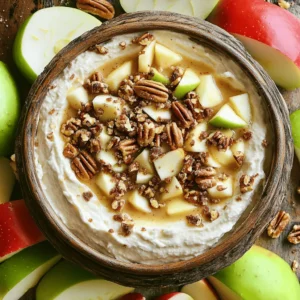To make this dip, you need a few key ingredients: - 2 large apples (such as Fuji or Granny Smith), cored and sliced into wedges - 1 cup cream cheese, brought to room temperature for easy mixing - 1/2 cup packed brown sugar for a rich sweetness - 1/4 cup powdered sugar to achieve the perfect creamy texture - 1 teaspoon pure vanilla extract for a hint of warmth - 1/2 cup toffee bits (and a little extra for topping) to add crunch and flavor These ingredients work together to create a rich and creamy dip that you will love. The apples add crispness, while the toffee bits give a sweet crunch. You can make your dip even better with some nice garnishes: - 1/4 cup crushed pecans or walnuts (optional, for garnish and added crunch) - Extra toffee bits for a sweet touch Adding these garnishes makes your dip look more inviting and adds more flavor. Before you start, gather these tools: - A medium mixing bowl - A hand mixer for easy blending - A spatula for folding and serving - A pretty serving dish to display your dip Having the right tools will make your dip-making process smooth and fun. You can find the full recipe for more details! Start by taking your cream cheese out of the fridge. Let it sit until it is room temperature. This makes it easier to mix. In a medium bowl, use a hand mixer to blend the cream cheese. Mix until it is smooth and creamy. You want to avoid any lumps. A good base is key for your dip. Next, it’s time to sweeten up the mix. Gradually add in the brown sugar and powdered sugar. Keep the mixer on low speed as you mix. This helps everything blend evenly. You want a sweet and creamy base that tastes just right. Now, let’s add some flavor! Carefully fold in the vanilla extract and toffee bits. Use a spatula for this step. Mixing gently ensures the toffee bits spread throughout. This adds great crunch and flavor in every bite. Once you mix it all together, it’s ready to serve. For the full recipe, check the earlier section. Enjoy your rich and creamy Apple Toffee Dip! To get a smooth and creamy dip, start with room-temperature cream cheese. Cold cream cheese can create lumps. Use a hand mixer to blend it well until it’s soft. Gradually add the sugars. Mixing on low speed helps keep the texture light. Make sure to scrape the sides of the bowl while mixing. This ensures that no lumps remain. For a great look, serve the dip in a beautiful bowl. You can arrange apple slices in a circle around the dip. It makes the dish inviting. Add small spoons next to the dip for easy serving. You can also include graham crackers or pretzels for variety. These add fun textures and flavors to the mix. If you have leftovers, store them in an airtight container. This keeps the dip fresh for up to three days. When ready to enjoy again, you can mix it lightly. This helps restore its creamy texture. If it looks a bit thick, you can add a splash of milk to loosen it up. Enjoy your dip again without losing quality! {{image_4}} You can use many kinds of apples in this dip. Fuji apples are sweet and crisp. Granny Smith apples add a nice tartness that works well with the dip's creaminess. Honeycrisp apples offer a juicy and sweet bite. If you want a softer texture, try Red Delicious. Each apple type brings its own taste to the party. Mix and match for fun flavors! While apple slices are classic, there are other tasty options. Graham crackers provide a sweet crunch that pairs well with the dip. Pretzels add a salty twist, which is a great contrast to the sweet dip. You can also use sliced pears or bananas for a different fruit flavor. Even mini cookies can make a fun addition. Get creative and let your guests choose! Enhancing your dip can take it to the next level. Try adding a pinch of cinnamon for warmth. A bit of nutmeg also gives it a nice fall flavor. If you love chocolate, mix in some mini chocolate chips or drizzle melted chocolate on top. For a nutty flavor, add chopped pecans or walnuts into the mix. These small changes can make a big difference in taste. For the complete recipe, check out the Full Recipe. To keep your Apple Toffee Dip fresh, store it in an airtight container. This helps avoid drying out and keeps flavors intact. Make sure the container is clean and dry before adding the dip. Avoid using metal containers, as they can react with the sugars. When stored properly, Apple Toffee Dip lasts about 3 to 5 days in the fridge. Be sure to check for any changes in smell or texture before serving. If it looks or smells off, it’s best to toss it. You can freeze Apple Toffee Dip, but the texture may change once thawed. To freeze, place the dip in a freezer-safe container, leaving some space at the top. This allows for expansion. It lasts up to 2 months in the freezer. To use, thaw it in the fridge overnight, then stir well before serving. For the best taste, use the dip fresh whenever possible. For the full recipe, check out the earlier section. You can dip many yummy things in Apple Toffee Dip. Fresh apple slices work best. They add a nice crunch and sweet flavor. You can also try graham crackers for a different taste. Pretzels give a salty twist that pairs well too. For a fun surprise, consider dipping bananas or strawberries. Each option offers a new flavor, making your party even better! Yes, you can prepare Apple Toffee Dip ahead of time. Make it a day before your event for ease. Just store it in the fridge in an airtight container. When ready to serve, take it out and let it sit for a few minutes. This helps bring back its creamy texture. If needed, stir it gently before serving for a smooth finish. You can make Apple Toffee Dip a bit healthier with easy swaps. Use low-fat cream cheese for a lighter option. You can also try using honey instead of brown sugar to cut down on refined sugar. Another idea is to add more nuts for healthy fats. Just remember, these changes might alter the taste slightly. Enjoy experimenting until you find your favorite version! Apple toffee dip is a fun and tasty treat. We covered key ingredients, easy steps, and handy tips. You learned how to make it creamy and delicious. Explore variations and storage options to keep it fresh. This dip suits many occasions, from parties to snacks. Now, you can enjoy it with different fruits and flavors. It's simple to whip up and will impress your friends. Give it a try, and have fun!