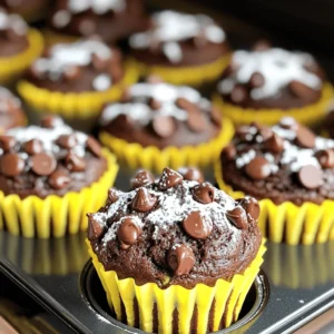 To make these tasty muffins, gather the following items: - 1 ½ cups shredded zucchini (about 1 medium zucchini) - 1 cup all-purpose flour - ½ cup whole wheat flour - ½ cup granulated sugar - ½ cup packed brown sugar - 1 teaspoon baking soda - ½ teaspoon baking powder - ½ teaspoon salt - 1 teaspoon ground cinnamon - 2 large eggs - ⅓ cup vegetable oil or melted coconut oil - 1 teaspoon pure vanilla extract - 1 cup semi-sweet or dark chocolate chips - ¼ cup chopped walnuts or pecans (optional) These ingredients create a rich, moist muffin with a delightful chocolate flavor. The zucchini adds moisture and nutrition without a strong taste. You can customize your muffins even more by adding: - ½ teaspoon nutmeg for a warm spice - 1 cup of shredded coconut for a tropical twist - ½ cup of dried fruit like cranberries or raisins for sweetness - A sprinkle of sea salt on top to enhance the chocolate flavor These options can give your muffins a unique twist and make them even more enjoyable. If you need to make swaps, here are a few ideas: - For gluten-free muffins, use a gluten-free flour blend. - Replace eggs with flaxseed meal mixed with water for a vegan option. - Use applesauce instead of oil for a lower-fat version. These substitutions allow everyone to enjoy these muffins, no matter their dietary needs. Remember to check the amounts for accurate measurements and flavor balance when making swaps. For the complete recipe, check out the Full Recipe. First, gather all your ingredients. You need zucchini, flour, sugars, eggs, and more. Measure each item carefully. This ensures a great taste. Preheat your oven to 350°F (175°C). This step is key to baking perfect muffins. Next, prepare your muffin tin with liners or cooking spray. This helps the muffins come out easily. 1. Mix Dry Ingredients: In a large bowl, combine all-purpose flour, whole wheat flour, baking soda, baking powder, salt, and cinnamon. Whisk them together until blended well. 2. Prepare Wet Ingredients: In another bowl, whisk together the eggs, granulated sugar, brown sugar, oil, and vanilla. Mix until smooth and creamy. 3. Incorporate Zucchini: Add the shredded zucchini to the wet mixture. Use a spatula to fold it in gently. 4. Combine Mixtures: Gradually add the dry ingredients to the wet mix. Stir until just combined. It’s okay to have some lumps. 5. Add Chocolate and Nuts: Gently fold in the chocolate chips and nuts if you use them. Make sure they’re evenly mixed. 6. Fill Muffin Cups: Use a spoon or ice cream scoop to fill each muffin cup about two-thirds full. This allows space for rising. 7. Bake Muffins: Place the muffin tin in your preheated oven. Bake for 18-22 minutes. Use a toothpick to check for doneness; it should come out clean. 8. Cool and Serve: When done, take the tin out and let the muffins cool for 5 minutes. Then, move them to a wire rack to cool completely. - Don’t Overmix: This keeps your muffins light and fluffy. - Use Fresh Zucchini: Fresh zucchini gives the best texture and flavor. - Check Doneness: Use a toothpick, and watch the time closely. - Add Extra Chocolate Chips: For a rich flavor, sprinkle some on top before baking. - Store Properly: Keep muffins in an airtight container to retain moisture. Try this full recipe to enjoy delightful muffins with a twist! To keep your muffins fresh, store them in an airtight container. This keeps moisture in and prevents them from drying out. You can keep them at room temperature for up to three days. If you want them fresh for longer, the fridge is a good option. Just remember, they may lose some of their fluffiness. Freezing is a great way to save muffins for later. Wrap each muffin tightly in plastic wrap or foil. Place them in a freezer bag and remove as much air as you can. They can last up to three months this way. To reheat, just take a muffin out and let it sit at room temperature. You can also warm it in the microwave for about 15-20 seconds if you want it warm right away. To keep your muffins moist, add just the right amount of zucchini. Too much zucchini can make them soggy. If you find your muffins are too wet, squeeze out some liquid from the shredded zucchini before mixing. Using a mix of whole wheat and all-purpose flour helps with texture, too. Enjoying your muffins warm adds to their softness and flavor. For a little extra touch, sprinkle some chocolate chips on top before baking for a nice look. {{image_4}} You can swap some ingredients to make these muffins healthier. Here are a few ideas: - Use whole wheat flour instead of all-purpose flour for more fiber. - Replace granulated sugar with honey or maple syrup. - Try unsweetened applesauce instead of vegetable oil for less fat. - Use almond milk or oat milk instead of regular milk for a dairy-free option. These changes keep the muffins tasty while boosting their health benefits. Mixing up flavors can make your muffins unique. Consider these options: - Add a teaspoon of nutmeg for a warm flavor. - Stir in some shredded coconut for a tropical twist. - Use peanut butter or almond butter for a nutty taste. - Add a handful of dried fruit like cranberries or raisins for extra sweetness. These variations can spark your creativity and make each batch special. You can easily turn this recipe into mini muffins. Here’s how: - Use a mini muffin tin instead of a standard one. - Fill each cup halfway. - Bake for about 12-15 minutes instead of 18-22 minutes. This makes a cute treat for parties or lunchboxes. Remember to check doneness with a toothpick. For even cooking, rotate the muffin tin halfway through baking. For the full recipe, check out the detailed steps and instructions to get the best results. Zucchini chocolate chip muffins are a tasty treat. Each muffin has about 180 calories. They also provide: - Fat: 8 grams - Carbohydrates: 25 grams - Protein: 3 grams - Fiber: 1 gram These muffins offer a balance of nutrients. The combination of flours adds fiber and protein. Chocolate chips give a sweet flavor, while zucchini adds moisture without extra fat. Zucchini is packed with vitamins. It is low in calories but high in water. This helps keep you hydrated. Whole wheat flour adds more fiber than regular flour. Fiber aids digestion and keeps you full longer. Eggs provide protein and essential nutrients. They help bind the muffins together. The healthy fats from vegetable oil or coconut oil support heart health. You can make these muffins gluten-free. Use gluten-free flour blends in place of regular flour. For a vegan version, substitute eggs with flax eggs. Mix 1 tablespoon of ground flaxseed with 3 tablespoons of water for each egg. These simple swaps let everyone enjoy the muffins. Whether you are gluten-free or vegan, you can savor this treat! If you want to explore more, check out the Full Recipe for delicious details. You can check if the muffins are done by inserting a toothpick into the center. If it comes out clean or with just a few crumbs, they are ready. Another good sign is that the tops will look golden brown and spring back when lightly pressed. If the toothpick has wet batter on it, bake them a few more minutes. This way, you ensure a perfect, moist muffin every time. Yes, you can use frozen zucchini! Just make sure to thaw it first and drain any extra water. Frozen zucchini may have a bit more moisture, so reduce other liquids in the recipe slightly. This helps keep your muffins from becoming too soggy. Using frozen zucchini is a great way to enjoy these muffins year-round. To keep your muffins fresh, store them in an airtight container at room temperature. They can last about 2-3 days this way. If you want them to stay fresh longer, consider freezing them. Place muffins in a freezer-safe bag or container. They can last up to 3 months in the freezer. When ready to eat, thaw them overnight in the fridge. Reheat them in the microwave for a warm treat. These zucchini chocolate chip muffins are easy to make and tasty. We covered essential and optional ingredients, with ideas for substitutions. You learned step-by-step instructions for baking and tips for perfect results. Storing and freezing can keep your muffins fresh. Consider trying fun variations like mini muffins or healthy swaps. This recipe gives you a delicious treat that fits into many diets. Enjoy baking these muffins as a simple way to add veggies to your snacks.
