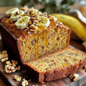 - 3 ripe bananas - 2 cups almond flour - 1/4 cup honey or pure maple syrup - 3 large eggs For this almond flour banana bread, the main ingredients are simple. You start with three ripe bananas. The riper, the better! Their sweetness will shine through. Next, you need two cups of almond flour. This flour gives the bread a nice texture and flavor. Add a quarter cup of honey or pure maple syrup for sweetness. Both options work well, so pick your favorite. Finally, three large eggs help bind everything together. They add moisture too. - 1/4 cup coconut oil - 1 teaspoon pure vanilla extract - 1 teaspoon baking soda - 1/2 teaspoon salt - 1/2 teaspoon ground cinnamon (optional) - 1/2 cup walnuts or pecans (optional) Now, let’s look at the additional ingredients. You will need a quarter cup of coconut oil. Make sure it is melted and slightly cooled before use. This oil adds richness to the bread. Then, add one teaspoon of pure vanilla extract for flavor. It makes a big difference! You also need one teaspoon of baking soda to help the bread rise. Half a teaspoon of salt balances the sweetness. If you like warm flavors, add half a teaspoon of ground cinnamon. It’s optional, but I recommend it! Lastly, if you want some crunch, add half a cup of walnuts or pecans. These nuts are also optional, but they add a tasty touch. You can find the full recipe for this delicious almond flour banana bread in the instructions section. - Preheat oven to 350°F (175°C). - Prepare a 9x5 inch loaf pan. - You can line it with parchment paper or grease it with coconut oil. This makes it easy to remove the bread later. - Combine mashed bananas, honey (or maple syrup), eggs, coconut oil, and vanilla extract. - Use a large bowl. Mix these well until smooth. This step helps blend the flavors and moisture. - Whisk together almond flour, baking soda, salt, and cinnamon. - Use a separate bowl. Make sure there are no lumps. This helps the bread rise evenly. - Fold wet and dry ingredients together. - Do this gently. You want to keep the batter light. - Gently incorporate nuts if using. - Walnuts or pecans add nice crunch. - Pour batter into the loaf pan. - Use a spatula to spread it evenly. - Bake for 50-60 minutes and check for doneness. - Insert a toothpick into the center. It should come out clean when ready. - Allow to cool in the pan for 10 minutes. - This makes it easier to remove. - Transfer to a wire rack. - Let it cool completely before slicing. Enjoy your freshly baked banana bread! If you want the full recipe, refer to the details above. To make the best almond flour banana bread, avoid overmixing the batter. Mixing too much can make the bread dense. You want to mix just until the dry ingredients blend with the wet ones. This keeps your bread light and fluffy. Use a gentle folding motion when combining. You can adjust sweetness by using sugar alternatives. Honey or pure maple syrup are great choices. You can also add spices for extra flavor. Ground cinnamon is a popular option, adding warmth to the bread. Try adding a pinch of nutmeg for a twist. For an enticing serve, slice the bread into thick pieces. Enjoy it warm for the best taste. Drizzle honey on top or spread almond butter for a treat. You can also enhance the look by topping each slice with chopped nuts or thin banana slices. This makes your almond flour banana bread not just tasty but also beautiful! {{image_4}} Almond flour is naturally gluten-free. This makes it a great choice for those with gluten intolerance. You can enjoy this bread without worrying about gluten. Just ensure your almond flour is certified gluten-free. This small step helps you avoid cross-contamination. To make this bread vegan, you need to replace the eggs and honey. Use flaxseed meal or chia seeds mixed with water. This mix acts like eggs. For sweetening, swap honey for maple syrup or agave nectar. This keeps the bread sweet and tasty without animal products. If you have nut allergies, you can still enjoy this banana bread. Simply leave out the nuts from the recipe. You can add seeds like sunflower or pumpkin instead. These add texture without the risk of nuts. Always check labels for allergens when buying ingredients. To keep your almond flour banana bread fresh, store it in an airtight container. Place it at room temperature for up to three days. If you live in a warm area, refrigerate it to avoid spoilage. Wrap the bread tightly in plastic wrap or foil before storing. This helps retain moisture and flavor. Freezing is a great way to store banana bread for longer. First, let the bread cool completely. Then, slice it into pieces for easy access. Wrap each slice in plastic wrap, followed by aluminum foil. Place the wrapped slices in a freezer-safe bag or container. This keeps the bread safe for up to three months. To enjoy your frozen banana bread, remove it from the freezer. Leave it in the fridge overnight to thaw slowly. If you need it fast, you can use the microwave. Heat a slice on low for 15-20 seconds. Always check to avoid overheating. For a crispy crust, warm the bread in the oven at 350°F for about 10 minutes. This helps restore its lovely texture. Yes, you can substitute almond flour for regular flour, but they behave differently. Almond flour is denser and has more fat. This means you may need less almond flour than regular flour. A good rule is to use about 1 cup of almond flour for every cup of regular flour. You may need to adjust the liquid in your recipe too. Almond flour makes baked goods moist and adds a nutty flavor. For the best flavor, you want very ripe bananas. Look for bananas that are brown with spots. These bananas have the most natural sweetness and flavor. They are also easier to mash. If your bananas are still yellow, let them sit for a few days. You can speed up the ripening by placing them in a paper bag. Absolutely! You can add many fruits or ingredients to the batter. Chopped nuts like walnuts or pecans add a nice crunch. You can also add chocolate chips for a sweet touch. Other fruits like blueberries or strawberries work well too. Just make sure to adjust the batter if you add more ingredients. This keeps the bread from becoming too wet. To check if your banana bread is done, use a toothpick. Insert it into the center of the bread. If it comes out clean, your bread is ready. If it has batter on it, bake for a few more minutes. The top should look golden brown, and the edges should pull away from the pan. This blog post shared how to make delicious almond flour banana bread. You need ripe bananas, almond flour, eggs, and honey. We covered each step, from mixing ingredients to baking and cooling. Remember, you can customize this bread to fit your taste. Try different nuts or flavors. With the right tips, you'll make a great loaf every time. Enjoy sharing it with friends and family. Happy baking!