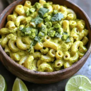 - Elbow macaroni - Olive oil - Onion and garlic - Vegetable broth and green chiles Green Chile Macaroni Sopita starts with simple yet vital ingredients. You need elbow macaroni, which gives the dish its classic feel. Olive oil adds rich flavor and helps cook the aromatics. An onion and garlic are key for depth. Vegetable broth and green chiles bring warmth and zest. Together, they create a cozy base. - Ground cumin - Smoked paprika - Salt and black pepper Next, we add spices. Ground cumin brings an earthy note. Smoked paprika adds a hint of sweetness and warmth. A touch of salt and black pepper rounds out the flavors. These spices are essential for a well-seasoned dish. They transform the simple ingredients into something special. - Shredded cheddar cheese - Fresh cilantro - Lime wedges for serving Finally, garnishes make the dish pop. Shredded cheddar cheese adds creaminess and richness. Fresh cilantro gives a burst of color and freshness. Lime wedges on the side add a tangy touch. You can customize these garnishes to fit your taste. For the full recipe, check out the detailed cooking steps. Enjoy making this flavorful comfort food! To start, you need a large pot. Fill it with water and add salt. Bring the water to a rolling boil. Once it bubbles, add your elbow macaroni. Cook it according to the package. This usually takes about 7-8 minutes. You want it to be al dente, which means it should be firm but cooked through. After cooking, drain the macaroni and set it aside. Next, take the same pot and add olive oil. Heat it over medium heat. Add your finely chopped onion to the pot. Sauté the onion for about 3-4 minutes. You want it to become soft and clear. Then, add the minced garlic. Stir it for about 1 minute. It should smell great, but be careful not to let it brown. Now, it's time for the fun part! Carefully pour in the vegetable broth. Add the canned diced green chiles next. Stir in the ground cumin, smoked paprika, salt, and black pepper. Mix it all well and bring it to a light simmer. Add the cooked macaroni back into the pot. Stir everything together so the flavors mix. Let it simmer on low heat for about 5 minutes. This allows the flavors to blend nicely. Finally, take the pot off the heat. Add the shredded cheddar cheese and stir. Keep stirring until the cheese melts fully. You will see a creamy texture form. Before you serve, taste it to check the seasoning. If needed, add a bit more salt or pepper. For the full details, check out the Full Recipe. To make your Green Chile Macaroni Sopita shine, cook the macaroni al dente. Al dente means the pasta is firm to the bite. This texture holds up well in the sopita. Boil salted water and cook the macaroni for 7 to 8 minutes. Drain it and set it aside. Simmering is key for flavor. After adding the broth and spices, let it simmer. A gentle simmer for about 5 minutes allows all the tastes to blend. This step makes your dish rich and warm. When you add cheese, timing is crucial. Remove the pot from heat before mixing in the cheese. Stir continuously as it melts for a smooth texture. This technique keeps the cheese creamy and prevents clumping. If you want an even creamier dish, try using cream cheese or sour cream. These options add richness and flavor. You can mix them in just before serving to enhance the texture. For a beautiful presentation, ladle the sopita into bowls. Garnish with freshly chopped cilantro for color and freshness. A sprinkle of cheese on top adds a nice touch, too. Pair this dish with lime wedges. The zesty lime juice brightens the flavors and balances the heat. You can also serve it with crusty bread or a simple salad. These sides make for a complete meal. {{image_4}} You can make your Green Chile Macaroni Sopita even heartier by adding protein. Chicken or turkey work great. Simply cook your choice of meat, chop it into small pieces, and mix it in during the simmer. If you prefer vegetarian options, beans are a fantastic choice. Black beans or pinto beans add protein and a nice texture. Just rinse them well and stir them in after adding the broth. Adjusting the spice level is easy. Different types of chiles can change the heat. For a mild sopita, use sweet green bell peppers. If you love heat, add jalapeños or serrano chiles. You can also mix chiles for a complex flavor. Always taste as you go to find your perfect spice balance. If you need a gluten-free option, swapping out regular macaroni is simple. Use gluten-free pasta made from rice or corn. These options cook well and hold the flavors nicely. You can also try other noodles like rice noodles or quinoa pasta. They provide a unique twist to this comforting dish. To store leftovers, let the sopita cool to room temperature. Then, place it in an airtight container. This helps keep the flavors fresh. You can store it in the fridge for up to three days. If you want it to last longer, freezing is a great option. For freezing, make sure the sopita is completely cool. Transfer it to a freezer-safe container or bag. Be sure to remove as much air as you can. This prevents freezer burn and keeps the dish tasty. You can freeze it for up to three months. When you're ready to eat, transfer it to the fridge to thaw overnight. You can reheat the sopita in two ways: in the microwave or on the stove. If using the microwave, place it in a bowl and cover it with a damp paper towel. This adds moisture and helps prevent dryness. Heat in short bursts, stirring in between. If you choose the stovetop, warm it in a pot over low heat. Add a splash of broth or water to keep it creamy. Stir often to avoid sticking. Enjoy your warm and comforting bowl of Green Chile Macaroni Sopita! Green Chile Macaroni Sopita is a warm and cozy dish. It combines creamy macaroni with green chiles. This dish has roots in Mexican cuisine. The flavors blend well, making it comforting and delicious. The addition of spices like cumin and smoked paprika gives it a unique kick. It's perfect for chilly nights or whenever you crave comfort food. Yes, you can easily make this dish ahead of time. Prepare it, then let it cool. Store it in an airtight container in the fridge. It stays fresh for up to three days. When you are ready to eat, just reheat it. Use a stovetop or microwave for best results. If it seems dry, add a splash of broth or water. If you want different flavors, try these substitutions: - Poblano peppers: They add a mild, smoky taste. - Jalapeños: They give a spicy kick. - Bell peppers: They offer a sweet, mild flavor. - Canned diced tomatoes: They add freshness without heat. These options keep the dish tasty and allow you to customize it. This blog post covered the essential elements of making a delicious Green Chile Macaroni Sopita. You learned about the key ingredients, like elbow macaroni and spices. I also shared step-by-step instructions for cooking, along with tips for perfect texture and serving ideas. Remember, you can customize this dish to fit your taste. Try adding proteins or adjusting the spice level. With leftovers, you can store and reheat properly for future meals. Enjoy creating your version of this tasty dish!