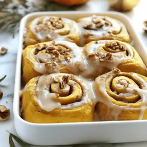 - 2 cups all-purpose flour - 1 tablespoon baking powder - 1/2 teaspoon salt - 1 tablespoon ground cinnamon - 1/4 teaspoon ground nutmeg - 1/4 cup granulated sugar - 1/2 cup canned pumpkin puree - 1/2 cup milk - 1/4 cup unsalted butter, melted - 1 teaspoon pure vanilla extract - 1/2 cup brown sugar - 1 tablespoon ground cinnamon - 1/4 cup chopped pecans (optional) - 1 cup powdered sugar - 2 tablespoons milk - 1/2 teaspoon pure vanilla extract These ingredients come together to form a warm, soft treat. Each one plays a role in making these rolls delightful. The all-purpose flour gives structure. Baking powder helps them rise. The spices add warmth and flavor. The canned pumpkin puree makes the rolls moist and adds a rich taste. Milk, butter, and vanilla extract enhance the dough's flavor and texture. For the filling, brown sugar and cinnamon create a sweet, spicy mix that is hard to resist. Chopped pecans give a lovely crunch, but they are optional. The icing made from powdered sugar, milk, and vanilla brings everything together. It adds sweetness and a creamy finish. Gather these ingredients, and you’re ready to create a cozy, delicious treat that celebrates the flavors of fall! 1. Preheat your oven to 375°F (190°C). Grease a 9x13 inch baking dish well. 2. In a large bowl, mix together the following dry ingredients: - 2 cups all-purpose flour - 1 tablespoon baking powder - 1/2 teaspoon salt - 1 tablespoon ground cinnamon - 1/4 teaspoon ground nutmeg - 1/4 cup granulated sugar 3. In another bowl, combine these wet ingredients: - 1/2 cup canned pumpkin puree - 1/2 cup milk - 1/4 cup melted unsalted butter - 1 teaspoon pure vanilla extract 1. Pour the wet mixture into the dry mixture. Stir until a dough forms. If the dough is sticky, add a bit more flour. 2. Lightly flour your counter. Roll the dough into a 10x14 inch rectangle. 3. Spread melted butter over the dough. Then, sprinkle on: - 1/2 cup brown sugar - 1 tablespoon ground cinnamon - Optional: 1/4 cup chopped pecans 4. Roll the dough tightly from one long side to the other. Cut the log into 1-inch thick pieces. Place these rolls in the greased baking dish, standing upright. 1. Bake the cinnamon rolls for 20-25 minutes. Look for a light golden color on top. A toothpick should come out clean. 2. While they bake, make the icing. Whisk together: - 1 cup powdered sugar - 2 tablespoons milk - 1/2 teaspoon pure vanilla extract 3. After baking, let the rolls cool for a few minutes. Drizzle the icing over the warm rolls. Enjoy every bite! To get the best rolls, start with even dough. When you roll out the dough, make it about 10x14 inches. Use a light hand, and don’t press too hard. If your dough sticks, sprinkle a little flour on the surface. For the right dough consistency, it should feel soft but not overly sticky. If it sticks to your fingers, add more flour slowly until it’s just right. You can make these rolls your own. If you want more spice, add extra cinnamon or nutmeg. Taste your filling and adjust to your liking. For fun add-ins, consider chopped dried fruits or chocolate chips. They add a nice surprise in each bite. Just remember to keep the balance, so the flavors blend well. When serving, present these rolls warm. Drizzle them with icing for a sweet touch. You can also sprinkle a little ground cinnamon or some chopped pecans on top. This adds color and texture. Pair these rolls with coffee or tea for a cozy treat. They also go well with a side of fresh fruit for a refreshing bite. {{image_4}} You can still enjoy these rolls without gluten. To make gluten-free pumpkin cinnamon rolls, use a gluten-free all-purpose flour mix. Look for a blend that includes xanthan gum. This helps mimic the texture of regular flour. You may also need to use a bit more liquid, like milk, to keep the dough soft. If you need a dairy-free version, swap out milk and butter. Use almond milk or oat milk instead of regular milk. For butter, try coconut oil or dairy-free butter. You can also make the rolls vegan by replacing the milk and butter. Use applesauce or a flaxseed meal mix instead of eggs. Make these rolls more festive by adding different flavors. For example, mix in maple syrup or apple pie spice. You can also change the filling. Instead of just brown sugar and cinnamon, try adding chopped apples or cranberries for a new taste. Each twist gives you a fresh take on a classic treat. To keep your cinnamon rolls fresh, store them in an airtight container. This will help maintain their soft texture. You can use a glass or plastic container with a lid. If you want extra freshness, wrap the rolls in plastic wrap before placing them in the container. This way, they stay moist and tasty for about 2-3 days. If you want to save some rolls for later, freezing is a great option. First, let the rolls cool completely. Then, wrap each roll in plastic wrap. Place the wrapped rolls in a freezer bag or container. Make sure to remove as much air as possible. Frozen rolls can last up to 3 months. To enjoy them again, thaw the rolls in the fridge overnight. Reheat them in the oven at 350°F for about 10-15 minutes. They will taste fresh and warm! Cinnamon rolls stay fresh in the fridge for about 4-5 days. After that, they may lose their soft texture. Look for signs of spoilage, like mold or an off smell. If the rolls feel dry or hard, it's best to toss them. Enjoy your tasty pumpkin cinnamon rolls while they are fresh! Yes, you can use fresh pumpkin. Fresh pumpkin has a different taste and texture than canned. To prepare fresh pumpkin, you must first cook it. Cut the pumpkin in half, remove the seeds, and roast it until soft. Then, scoop out the flesh and puree it. This can take more time than using canned pumpkin. However, it gives a fresher flavor and a unique twist to your rolls. You can tell the rolls are done when they are golden brown on top. Another way to check is to insert a toothpick into the center of a roll. If it comes out clean, the rolls are ready. If there is wet dough on the toothpick, they need more time. Keep an eye on them to avoid overbaking. Yes, you can prepare some parts ahead. You can mix the dry and wet ingredients separately and store them in the fridge. You can also roll and cut the dough. Place the rolls in the baking dish, cover, and chill them overnight. In the morning, bake them as usual. For leftovers, store them in an airtight container. Reheat in the oven for a warm treat! In this blog post, we explored how to make delicious cinnamon rolls. We covered essential ingredients, from dry and wet components to filling and icing. I provided clear steps for preparing the dough and baking the rolls. We also discussed tips for customization and storage. Remember, you can adjust flavors or tweak the recipe to fit your taste. Enjoy these tasty treats fresh or reheated later. Happy baking!