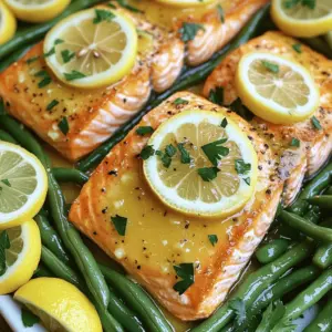 To make this dish, start with fresh, high-quality ingredients. You will need: - 4 salmon fillets (about 6 oz each) - 1 pound fresh green beans, trimmed at the ends Using fresh salmon ensures your dish tastes great. Look for salmon that is bright and moist. The green beans add a nice crunch and color to your plate. The lemon butter adds a zesty kick. Gather these items: - 2 tablespoons unsalted butter, melted - 2 tablespoons freshly squeezed lemon juice - 1 teaspoon lemon zest (from about 1 lemon) - 2 cloves garlic, finely minced - Salt and black pepper to taste This mixture brings out the best flavors in salmon and green beans. The garlic adds depth, while the lemon brightens the dish. Garnishes make your dish look pretty and add flavor. You will want: - Lemon slices, for garnish - Fresh parsley, chopped, for garnish Adding lemon slices gives a fresh look and a bit more citrus flavor. The parsley adds a pop of green and a fresh taste. First, you need to preheat your oven to 400°F (200°C). This temperature helps cook the salmon and green beans just right. It makes them tender and flavorful. Next, grab a small bowl. In it, whisk together 2 tablespoons of melted butter, 2 tablespoons of fresh lemon juice, and 1 teaspoon of lemon zest. Add 2 cloves of finely minced garlic. Mix in a pinch of salt and some black pepper. This sauce will add a bright, zesty flavor to your dish. Now, take a large baking sheet and line it with parchment paper. Place 4 salmon fillets in the center. Make sure to space them evenly. Surround the salmon with 1 pound of fresh green beans, trimmed at the ends. This makes the dish colorful and inviting. Drizzle half of your lemon butter sauce generously over the salmon. Use the rest to drizzle over the green beans. Toss the green beans gently in the pan to coat them well. Then, drizzle 1 teaspoon of extra virgin olive oil over the beans. Season them with more salt, pepper, and sprinkle 1 teaspoon of dried thyme on top. Put the baking sheet in the preheated oven. Bake for about 12-15 minutes. The salmon should look opaque and flake easily with a fork. The green beans should be tender but still have a nice crunch. Once everything is cooked, take the baking sheet out of the oven. For a fresh touch, garnish the salmon with lemon slices. Sprinkle chopped fresh parsley over both the salmon and green beans. This adds color and flavor. Serve the dish warm and enjoy the delightful mix of citrus and fresh ingredients. To get the best salmon, start with fresh fillets. Look for bright color and firm texture. When you bake, keep an eye on the time. Salmon cooks quickly, about 12 to 15 minutes. Check it at 12 minutes. The fish should look opaque and flake easily with a fork. If you have a thermometer, aim for 145°F in the thickest part. This gives you juicy, tender salmon every time. Fresh green beans make a big difference. Trim the ends for a neat look. Toss them in olive oil, salt, and pepper before baking. This adds a nice flavor. You can also add garlic for a punch. A sprinkle of fresh thyme brightens their taste. If you want more zest, squeeze extra lemon juice on them right before serving. This will make them pop with flavor. Presentation matters, even for simple meals. Use a large white platter to showcase your dish. Place the salmon in the center and surround it with green beans. For a touch of color, add lemon slices and chopped parsley on top. This not only looks great but also invites your guests to dig in. Serve extra lemon wedges on the side for more zesty flavor. A colorful dish makes every meal feel special. {{image_4}} You can make this dish even better by adding more veggies. Try bell peppers, carrots, or zucchini for extra color and flavor. Cut them into bite-sized pieces so they cook evenly. Toss these vegetables with the lemon butter mix just like the green beans. This way, you get a tasty mix of flavors and nutrients. Feel free to switch up the seasonings for a new taste. Instead of thyme, try rosemary or dill for a different aroma. You can also add a pinch of red pepper flakes for some heat. A splash of soy sauce can add a savory note. Experiment and find the flavor that you love best! Don't limit yourself to just salmon. Other fish like trout, cod, or tilapia work great too. Just adjust the cooking time based on the thickness of the fish. These options provide new flavors while keeping the dish simple and quick. Enjoy the variety and see which fish you like best! After enjoying your sheet pan lemon butter salmon and green beans, let leftovers cool. Store them in an airtight container. Place the salmon and green beans together or separately. They stay fresh for up to three days in the fridge. Make sure to label the container with the date. This helps you keep track of when you made it. To reheat, use your oven for the best taste. Preheat your oven to 350°F (175°C). Place the salmon and green beans on a baking sheet. Cover them with foil to keep moisture in. Heat for about 10 minutes or until warmed through. You can also use a microwave. Heat in short bursts of 30 seconds, checking often to avoid overcooking. You can freeze leftovers if you want to save them for later. Wrap the salmon and green beans tightly in plastic wrap. Then place them in a freezer-safe container or bag. They can stay in the freezer for up to three months. When you're ready to eat, thaw in the fridge overnight. Reheat as mentioned above for the best results. Cooking salmon takes about 12 to 15 minutes in the oven. This time may vary based on the thickness of the fillets. When the salmon turns opaque and flakes easily, it is ready. I recommend checking the salmon at the 12-minute mark to avoid overcooking. Overcooked salmon can become dry and lose its rich flavor. Yes, you can use frozen salmon! Just make sure to thaw it first. You can thaw salmon overnight in the fridge. If you need it quicker, run it under cold water for about an hour. Keep in mind that cooking time may increase slightly for frozen fillets. You can serve salmon and green beans with a variety of sides. Here are some ideas: - Quinoa or rice for a filling base. - A fresh salad for a light complement. - Roasted potatoes for added texture. - Garlic bread to soak up the lemon butter sauce. These sides will elevate your meal and create a balanced plate. This blog post covered a simple and tasty way to make salmon and green beans. We talked about the key ingredients, like the lemon butter sauce and garnishes, to make your dish pop. You learned the step-by-step instructions for baking, plus tips for perfect cooking and serving. We explored variations to keep meals fresh and discussed how to store leftovers. Remember, cooking should be fun. Use this recipe as a base, and get creative! Enjoy your delicious meal!