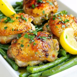 - 4 bone-in chicken thighs, skin-on - 2 tablespoons extra virgin olive oil - 4 cloves garlic, finely minced - Zest and juice of 1 large fresh lemon - 1 teaspoon dried oregano - 1 teaspoon smoked paprika - Sea salt and freshly cracked black pepper, to taste - 300g fresh green beans, trimmed - 2 tablespoons unsalted butter, cut into small pieces - Fresh parsley, finely chopped (for garnish) - Fresh thyme or rosemary can add more herbal notes. - A splash of white wine will enhance the dish's depth. - Red pepper flakes will give a spicy kick. - Look for chicken thighs with firm skin and no discoloration. - Choose lemons that feel heavy for their size; they are juicier. - Select fresh green beans that are bright green and crisp. - Avoid beans that look wilted or have brown spots. - Always smell the garlic; it should be fresh and pungent. {{ingredient_image_2}} 1. Preheat the oven: Set your oven to 425&deg;F (220&deg;C). This helps cook the chicken evenly. 2. Prepare your baking sheet: Line it with parchment paper. This makes cleanup easier. 3. Make the marinade: In a bowl, mix olive oil, minced garlic, lemon zest, lemon juice, oregano, smoked paprika, salt, and pepper. This adds great flavor to the chicken. 4. Prepare the chicken: Pat the chicken thighs dry with paper towels. This helps the skin crisp up. 5. Marinate the chicken: Place the chicken in a large bowl and pour the marinade over it. Make sure each piece is well coated. Let it sit for at least 15 minutes. 1. Blanching green beans: Boil salted water in a pot. Add trimmed green beans for 2-3 minutes. They should turn bright green and stay tender-crisp. Drain them and set aside. 2. Searing chicken: Heat a large skillet on medium-high heat. Place the marinated chicken thighs skin-side down. Sear for 5-7 minutes until golden brown, then flip and sear for 3-4 minutes on the other side. 3. Baking: Transfer the chicken to the baking sheet, skin-side up. Arrange the blanched green beans around the chicken. Dot with butter for extra richness. Bake for 25-30 minutes. - Chicken doneness: The internal temperature of the chicken should reach 165&deg;F (75&deg;C). Use a meat thermometer to check. - Resting time: After baking, let the chicken rest for 5 minutes. This helps keep it juicy. Marinating chicken is key for flavor. Here are my tips to do it right: - Use a good mix: Combine olive oil, garlic, lemon zest, and juice. This adds moisture and taste. - Time matters: Marinate for at least 15 minutes. For a deeper flavor, try 2 hours. - Don&rsquo;t skip the salt: Sea salt enhances the taste. It also helps the chicken stay juicy. Crispy skin makes chicken so tasty. Follow these steps for the best result: - Pat dry: Use paper towels to remove moisture from the chicken skin. This helps it crisp up. - Hot skillet: Sear the chicken in a hot skillet first. This gives a nice golden color. - Oven finish: Bake the chicken skin-side up. This keeps the skin crispy while cooking through. Green beans can be more than just a side. Here&rsquo;s how to boost their flavor: - Blanch first: Boil the green beans for 2-3 minutes. This keeps them bright and crunchy. - Butter finish: Add small pieces of butter on top before baking. This enriches their taste. - Season well: Sprinkle some salt and pepper after cooking. Fresh herbs can also add a nice touch. Pro Tips Marinate Longer for Flavor: If time allows, marinate the chicken thighs for a few hours or overnight in the refrigerator. This will intensify the flavor and tenderness of the meat. Use a Meat Thermometer: To ensure perfectly cooked chicken, use a meat thermometer to check that the internal temperature has reached 165&deg;F (75&deg;C). Blanch the Beans: Blanching the green beans before roasting helps maintain their vibrant color and crisp texture, making them more appealing on the plate. Rest Before Serving: Let the chicken rest for a few minutes after baking. This allows the juices to redistribute, resulting in juicier and more flavorful chicken. {{image_4}} You can easily swap chicken thighs for other cuts. Boneless chicken thighs work well too. They cook faster but still stay juicy. You may also use chicken breasts for a leaner option. Just remember, breasts may dry out if overcooked. Feel free to add more veggies to this dish. Carrots add sweetness and color. Bell peppers bring crunch and a pop of flavor. You can also try adding zucchini or asparagus for a fresh twist. Mix and match based on what you have at home. Spice up the chicken with different seasonings. Try rosemary for a fragrant touch. Cumin adds warmth and depth. For a kick, toss in some red pepper flakes. You can also play with herbs like thyme or basil for unique flavors. To store leftover Lemon Garlic Chicken Thighs and green beans, let them cool first. Once cool, place them in an airtight container. Make sure to separate the chicken and beans to keep them fresh. Store them in the fridge for up to 3 days. Label the container with the date for easy tracking. When you're ready to enjoy your leftovers, preheat your oven to 350&deg;F (175&deg;C). Place the chicken and green beans on a baking sheet. Heat them in the oven for about 15-20 minutes. This method keeps the chicken skin crispy. You can also use a microwave, but the skin may not stay crispy. If you want to save some for later, freezing is a great option. First, let the chicken and beans cool completely. Wrap each chicken thigh in plastic wrap and then place them in a freezer-safe bag. Store the green beans in a separate bag. Label both bags with the date. They can last in the freezer for up to 3 months. To reheat, thaw in the fridge overnight before following the reheating instructions. Yes, you can use boneless chicken thighs. They cook faster than bone-in thighs. This change will reduce the cooking time by about 10 minutes. Always check the internal temperature to make sure they reach 165&deg;F (75&deg;C). You can substitute green beans with other vegetables. Broccoli, asparagus, or snap peas work well. These vegetables also cook quickly and add nice color to the dish. Be sure to adjust the cooking time based on the veggies you choose. Check the chicken's internal temperature with a meat thermometer. The safe temperature is 165&deg;F (75&deg;C). If you don&rsquo;t have a thermometer, cut into the thickest part of the thigh. The juices should run clear, not pink. This post covered key ingredients, cooking steps, and storage tips. You learned how to select fresh items and marinate chicken for flavor. We discussed techniques for crispy skin and different vegetable options. You now know how to store leftovers and reheat meals safely. Cooking can be fun and easy with these tips. Enjoy trying new flavors while keeping meals simple and tasty. Keep experimenting, and you'll find what you love!